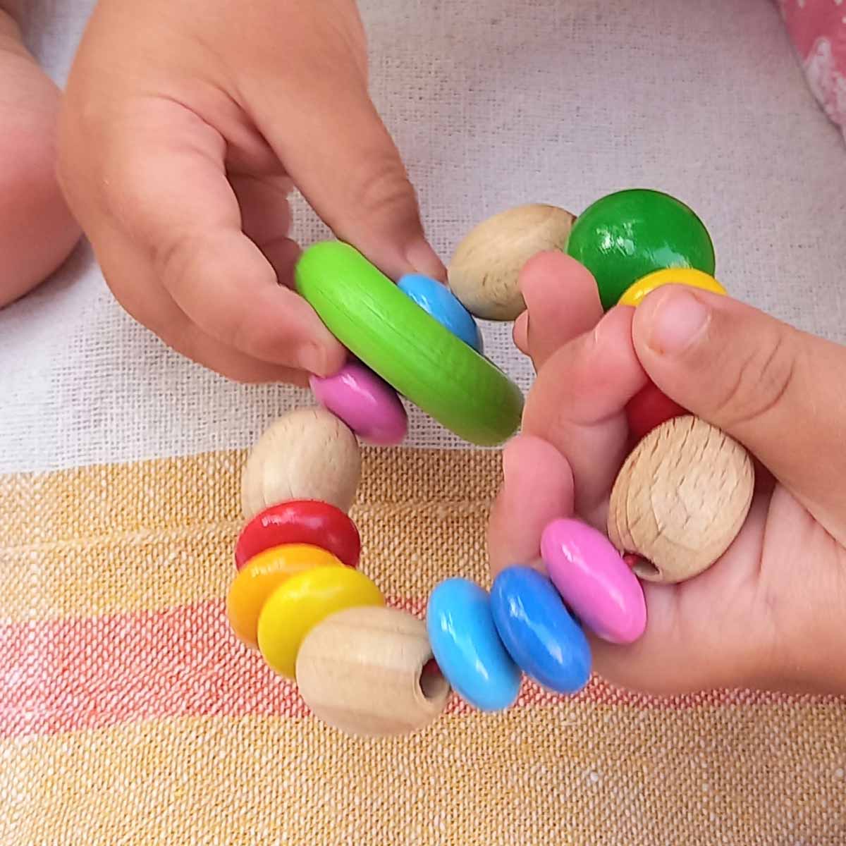 The Dida Colorini sonaglio neonato legno 8 cm